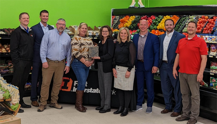 Pictured left to right: Market President Shann Scott, Commercial Relationship Manager David Fenno, SBA Montana Lender Relations Specialist Tom White, SBA Montana Lender Relations Specialist Rena Carlson, Regional President Jocelyn Lane, Chief Banking Officer Lorrie Asker, Market President Brian Brown, SBA Lending Specialist Jeff McGough, and Lockwood IGA owner David Robinson.